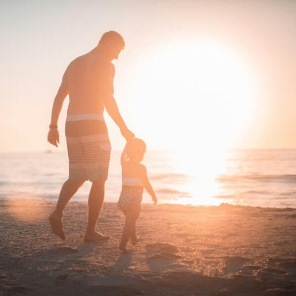 man with kid. Call to freedom life insurance solutions to protect your family